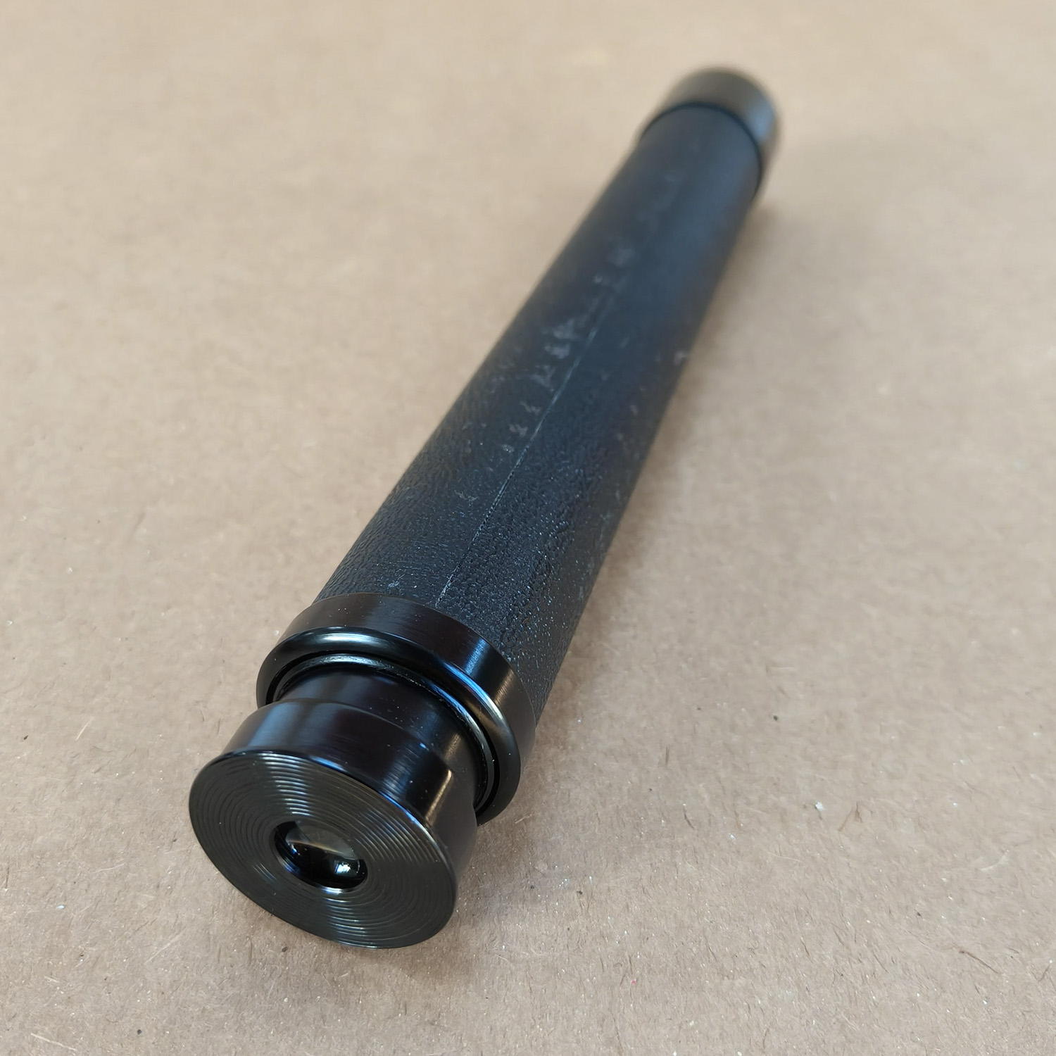 For sale is a vintage N & B Ltd London “PETREL” x30 handheld 2-draw telescope, complete with its original brown canvas and leather carry case. This is a classic British-made tubular spyglass with a 30× fixed magnification, designed for field use, birdwatching, nautical spotting, and general outdoor observation. The telescope features a black textured metal body, a smooth draw-tube extension, and quality optics typical of mid-20th-century British craftsmanship.