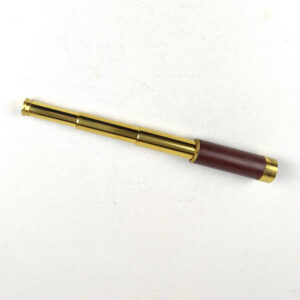 This is a stylish vintage-style Tasco 25x30mm 1AGST 3-draw brass spyglass / pocket telescope with a stitched red-brown leather wrap. It features a classic 3-draw extendable design, smooth focusing, and clear optics—perfect for display, collecting, hiking, birdwatching, boating, or gifting.